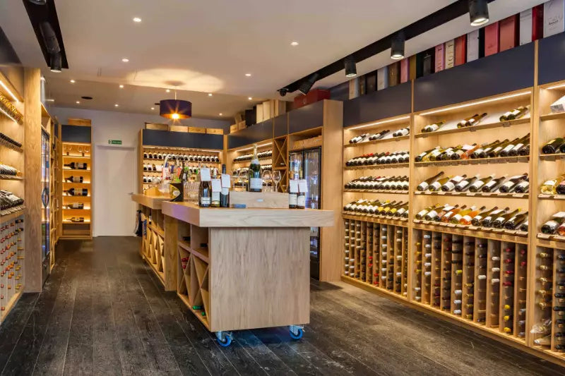 Luxury wine display at Friarwood Wimbledon Village, offering a curated selection of fine wines.