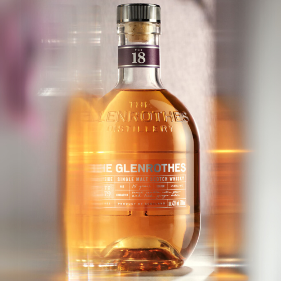 The Glenrothes 18 Year Old Single Malt Whisky bottle, showcasing its amber hue and elegant design, crafted in Speyside, Scotland.