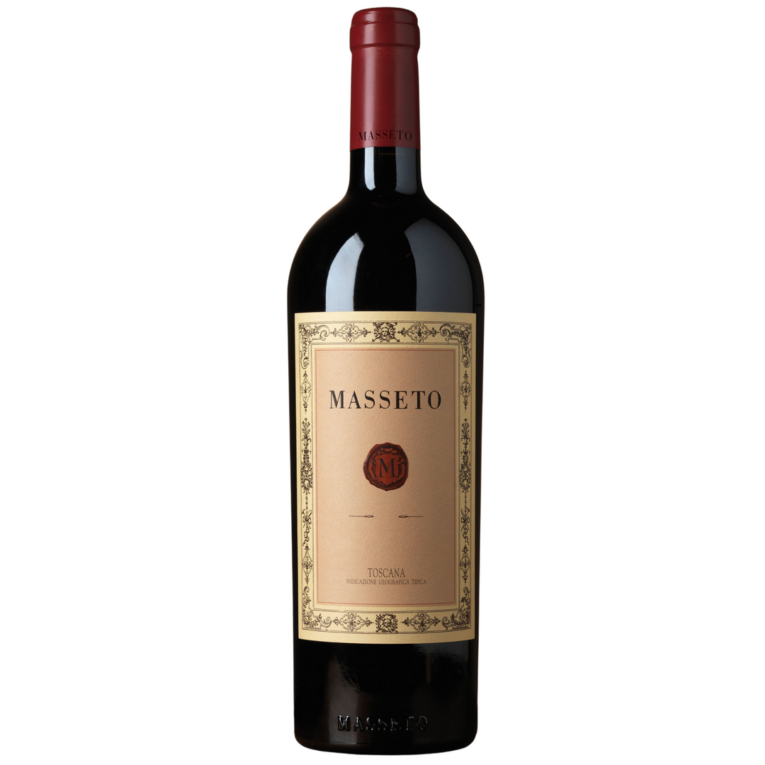 A bottle of Masseto wine with a classic beige label, featuring the iconic red Masseto logo and elegant gold detailing.