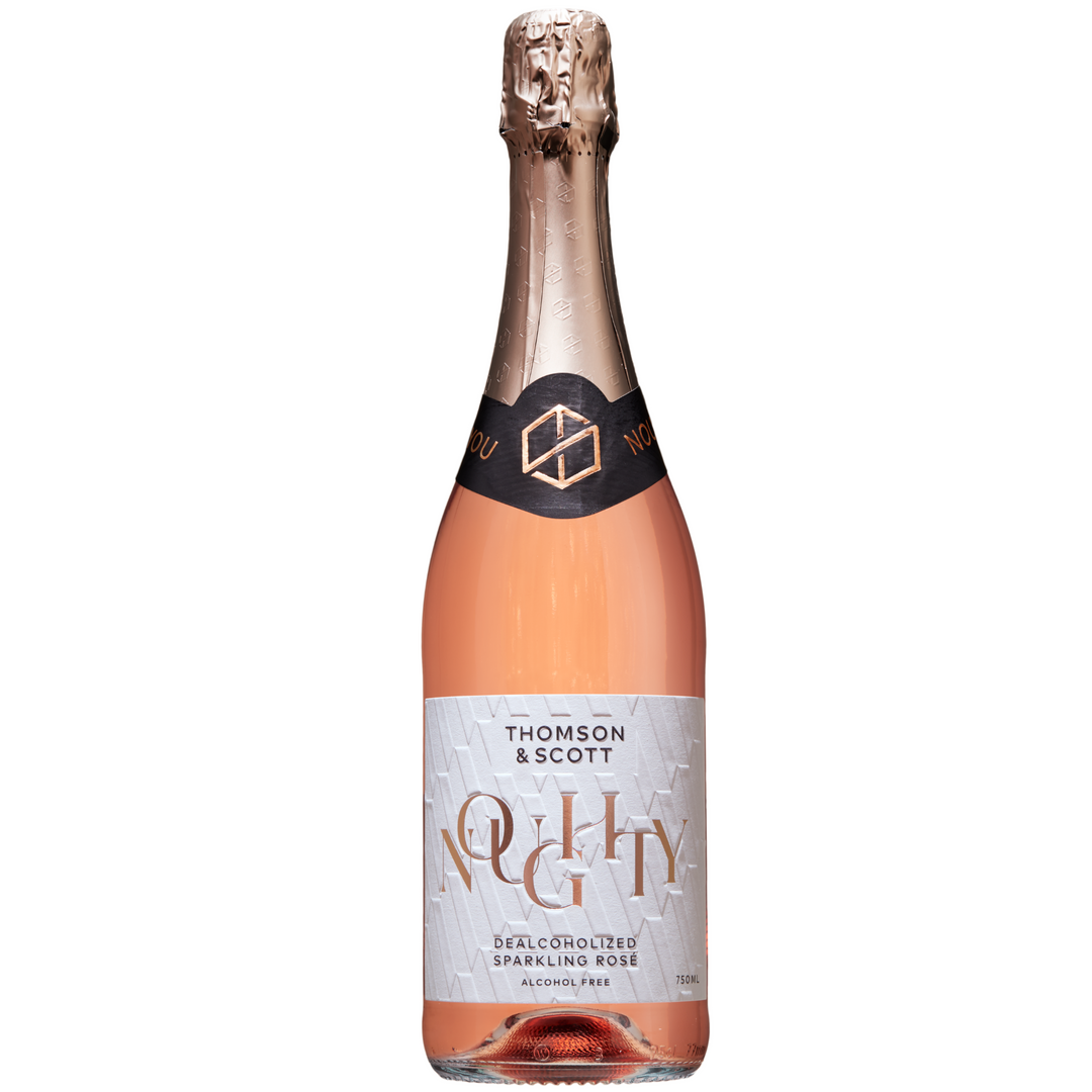 A beautifully styled bottle of Noughty dealcoholized Sparkling Rosé by Thomson & Scott, featuring elegant pink and gold details.