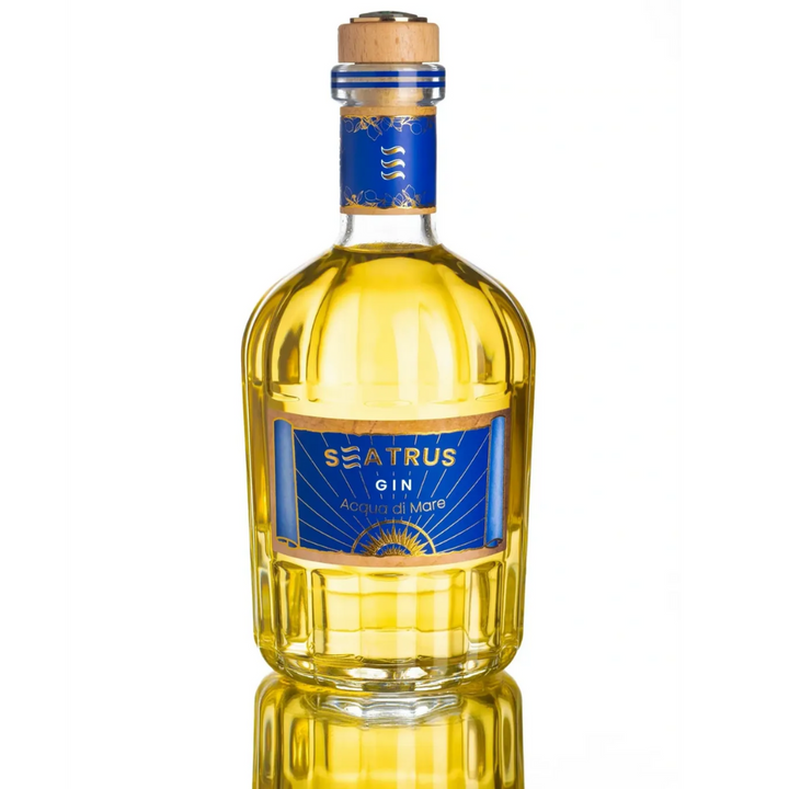 A bottle of Seatrus Gin Acqua di Mare, featuring its distinctive golden hue and elegant blue label.