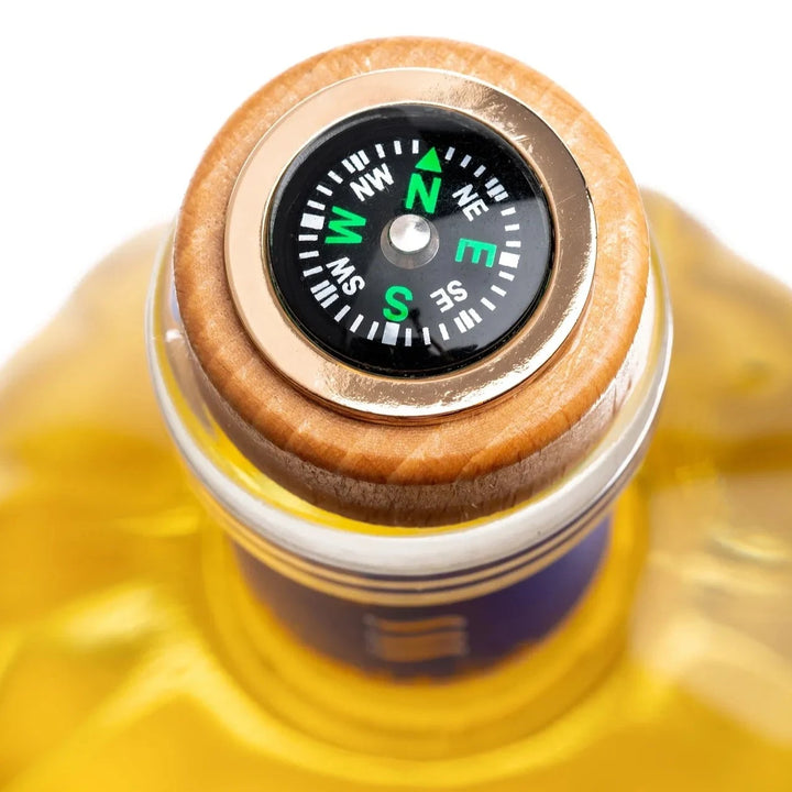 Close-up of the compass detail on the Seatrus Gin bottle cap, highlighting its elegant nautical design.