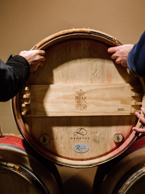 Traditional oak barrels aging fine Bordeaux wines at Château Pichon Longueville Comtesse de Lalande.