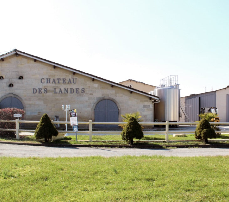 The historic exterior view of Château des Landes winery, producing fine Bordeaux wines.