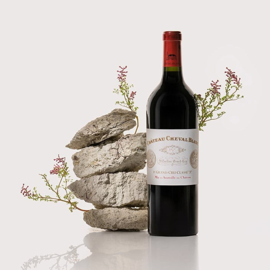 Bottle of Château Cheval Blanc wine elegantly displayed with natural elements, reflecting the essence of terroir.