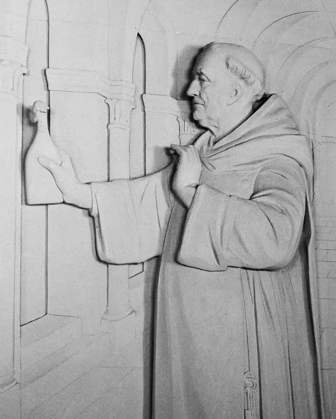 A historical relief of Dom Pérignon, the Benedictine monk credited with pioneering Champagne winemaking techniques.