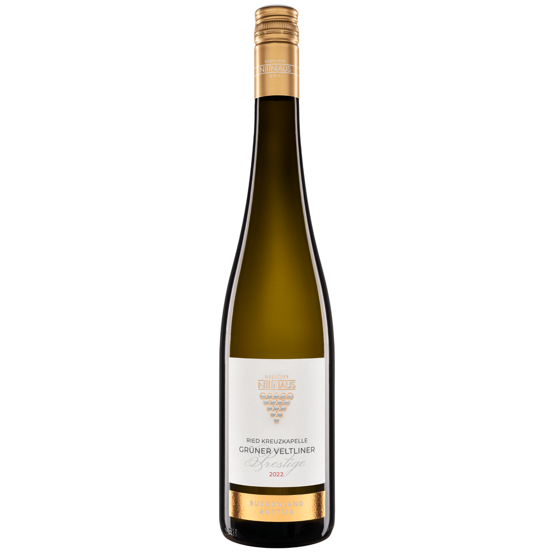 A bottle of Grüner Veltliner Ried Kreuzkapelle 2022, showcasing its elegant gold and white label, a premium Austrian wine from Burgenland.