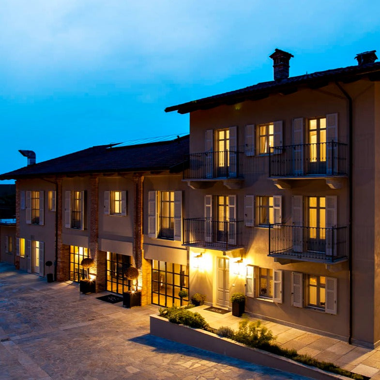 Réva estate building illuminated during the evening.