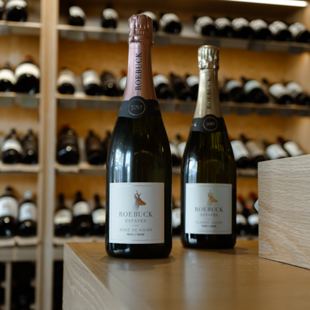 Bottles of Roebuck Estates Rosé de Noirs and Classic Cuvée sparkling wines.