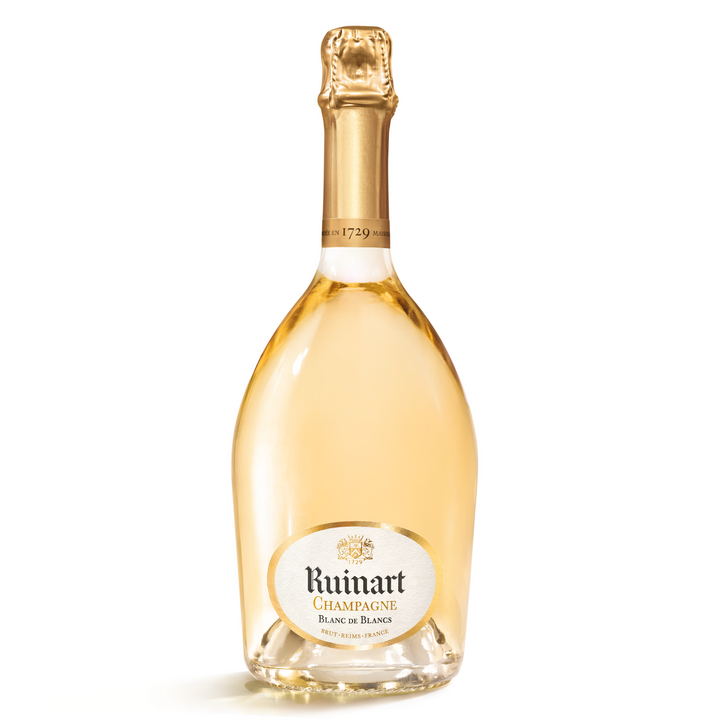 A bottle of Ruinart Blanc de Blancs Champagne with its signature golden hue, representing the purest expression of Chardonnay.