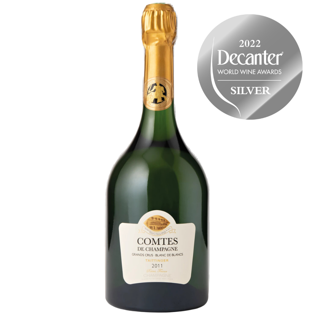 A bottle of Taittinger Comtes de Champagne 2011 Blanc de Blancs with a Decanter World Wine Awards Silver Medal badge.