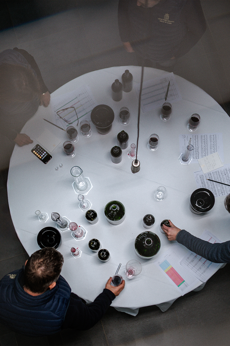 Winemakers at Château Pichon Longueville Comtesse de Lalande conducting a blending session to craft the perfect Pauillac wine.