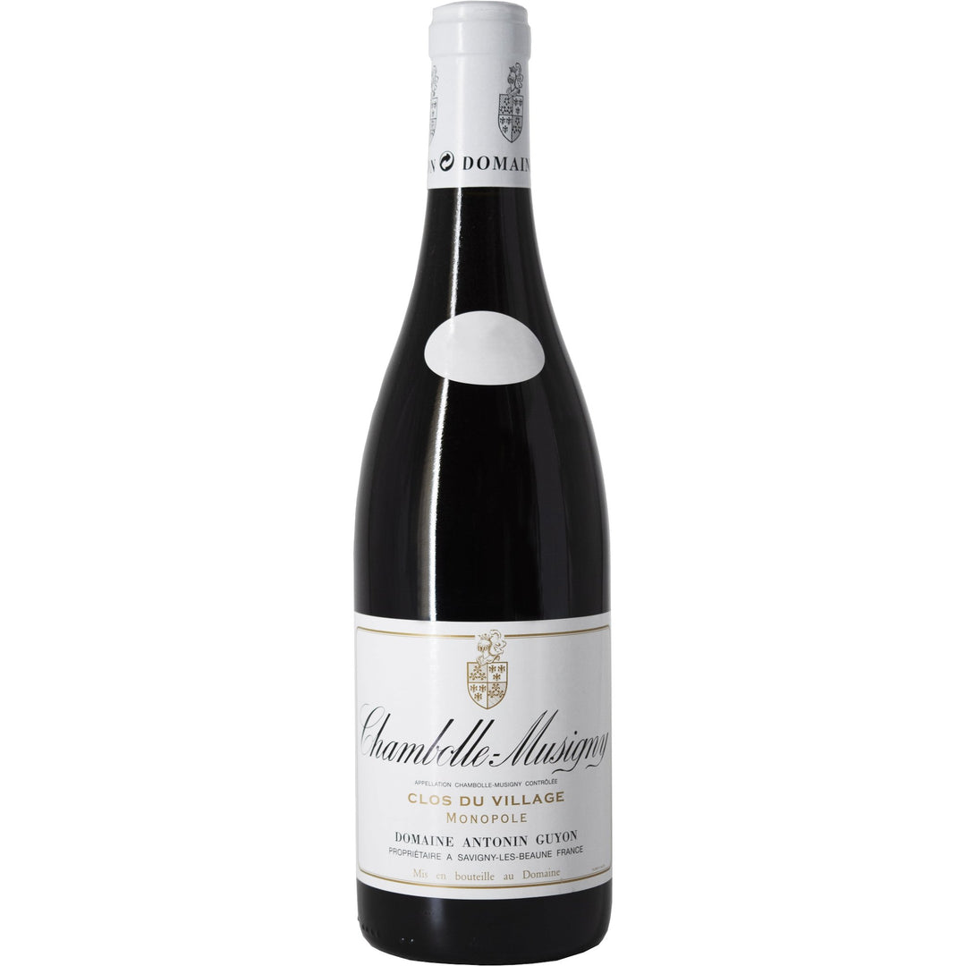 Bottle of Domaine Antonin Guyon Chambolle Musigny 'Clos du Village' Monopole, a prestigious Burgundy red wine known for its floral aromas and aging potential