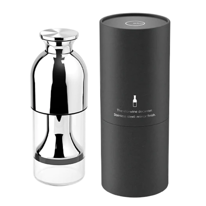 The eto wine decanter in stainless steel mirror finish, displayed alongside its sleek black cylindrical packaging. Perfect for wine preservation.