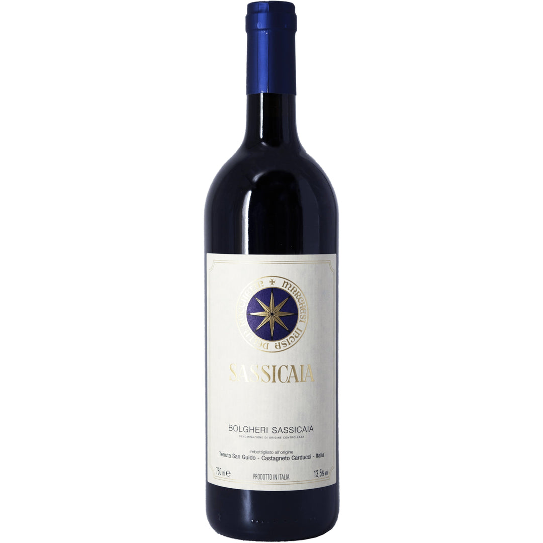 A bottle of Sassicaia Bolgheri DOC, an iconic Italian red wine with a distinguished blue and gold label.