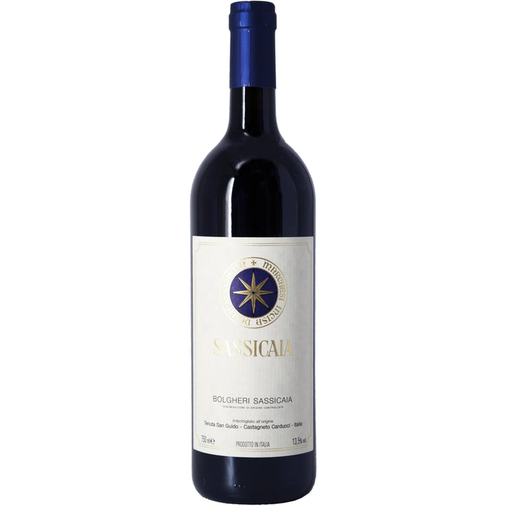 A bottle of Sassicaia Bolgheri DOC, an iconic Italian red wine with a distinguished blue and gold label.